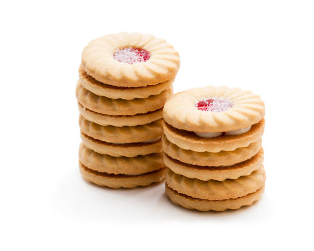 istock Stacked  shortcake biscuits sandwiched with cream and jam isolated on white 969174752