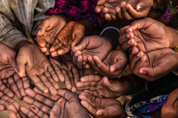 istock Hands of poor - asking for help, Africa 969175016