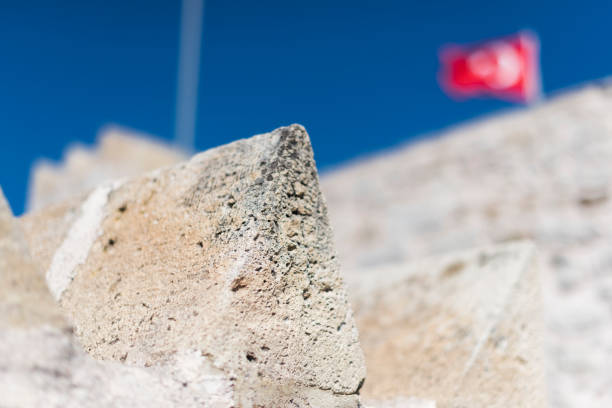 Close-up of Battlements, on the background blurred Turkish flag