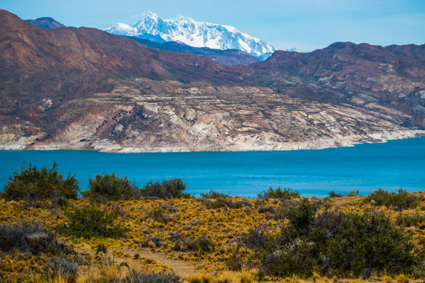 istock Blue lake and mountains with snow 969180354