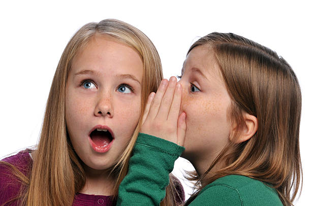 istock Two girls telling a secret and 96918317