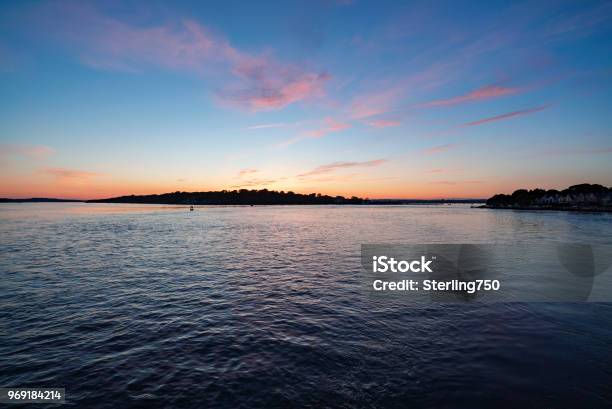 Sunset Over Poole Harbour In Dorset Stock Photo - Download Image Now - Beauty, Bournemouth - England, Colors