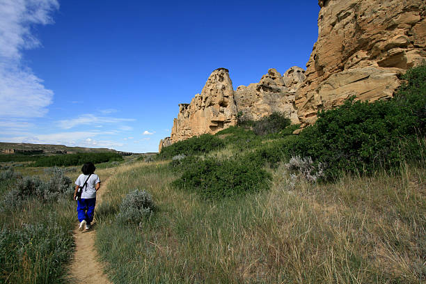 Woman Walking on Hoodoo Trail stock photo