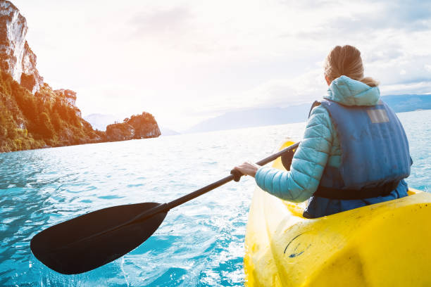 istock Woman paddles kayak 969187028