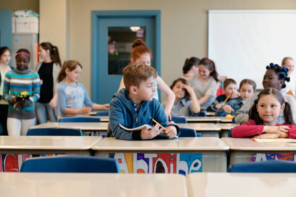 istock Multi-ethnic students coming into the class for the first day at school 969188312