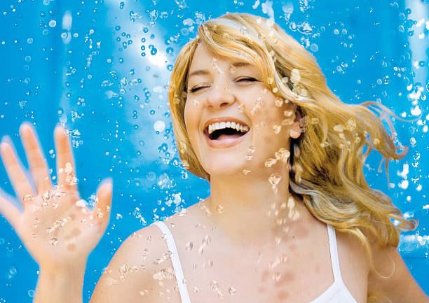 Water features 2  shower women falling water human face stock pictures, royalty-free photos & images