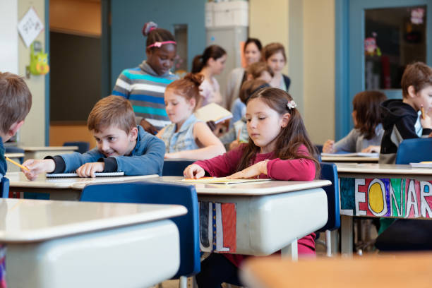 istock Multi-ethnic students coming into the class for the first day at school 969190668
