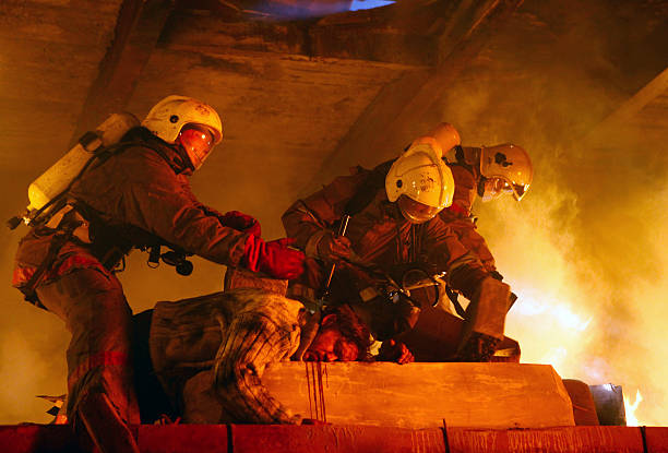 istock Firefighters in flames rescuing an accident victim 96920005