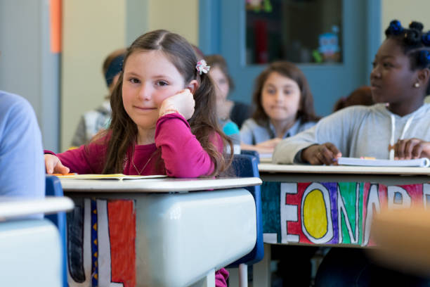 istock Multi-ethnic students sit into the class for the first day at school 969200798
