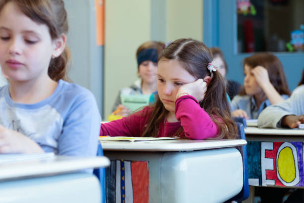 istock Multi-ethnic students sit into the class for the first day at school 969200816