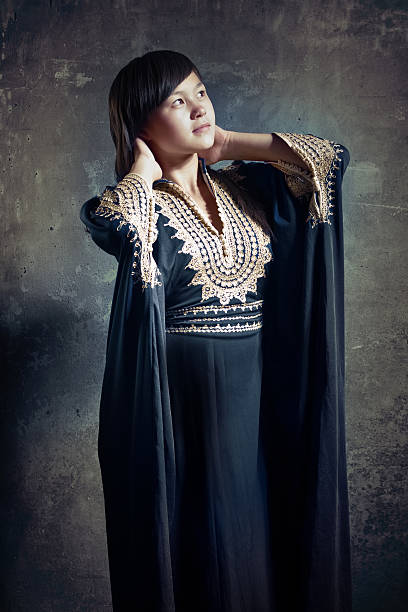 istock Asian girl in dark blue robe. 96920276