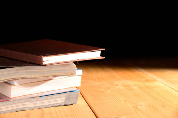 istock Stack of books on wooden table. 969223520