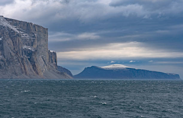 istock Looming Cliffs in a Glacial Fjord 969226072