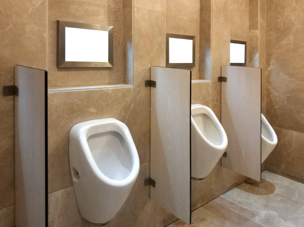 urinals and advertisement frames with clipping path - urinal clean contemporary in a row imagens e fotografias de stock