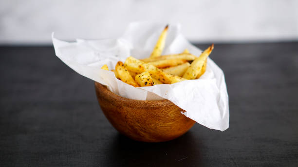 istock French fries on black background 969226902
