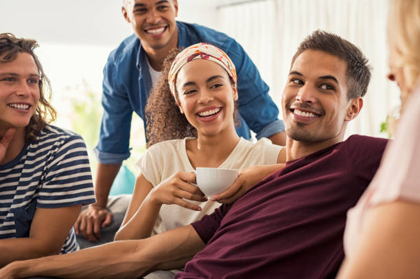 istock Happy young friends at home 969231306