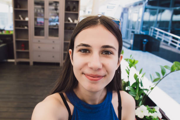 istock A very pretty girl doing selfie at a cafe 969231456