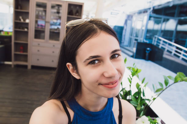 istock A very pretty girl doing selfie at a cafe 969231498
