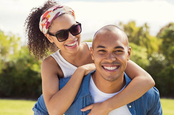 istock Woman enjoying piggyback ride 969231516