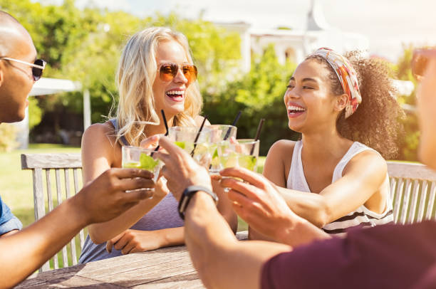 Friends toasting with cocktails