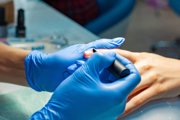 istock The master does a manicure in the salon 969234452
