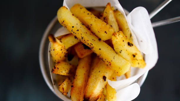 istock French fries on black background 969234936