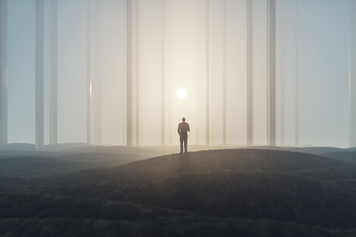 Lost businessman in foggy landscape with mirror columns.