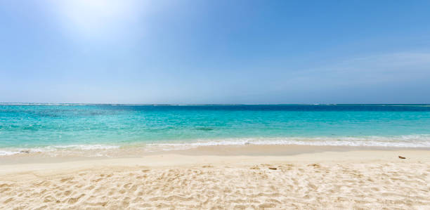Panoramic view of a white sand beach with turquoise waters in the Caribbean sea stock photo