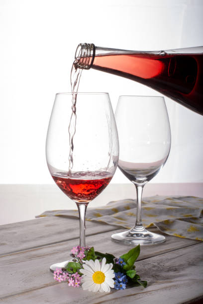 istock Rose wine served with two glasses and flowers copy space close up 969240422