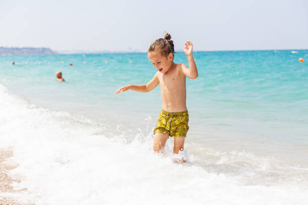 istock Beautiful boy and the sea 969243542