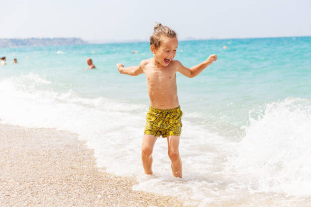 istock Beautiful boy and the sea 969245666