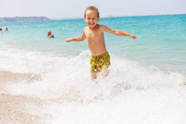 istock Beautiful boy and the sea 969245694