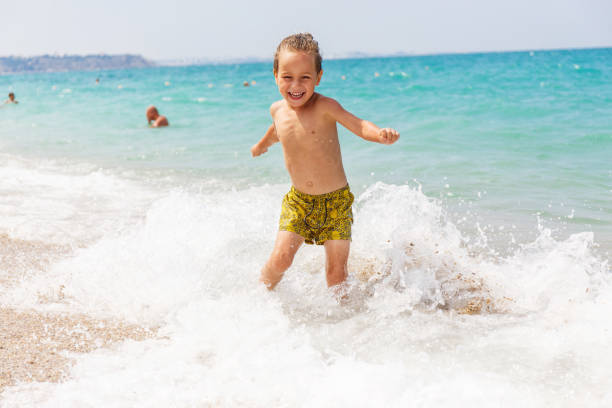 istock Beautiful boy and the sea 969245720