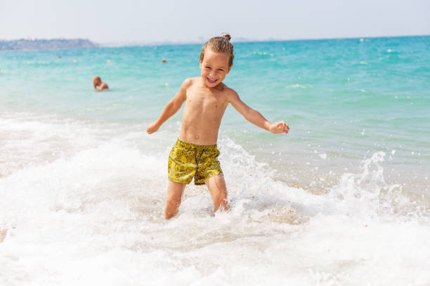 istock Beautiful boy and the sea 969245756