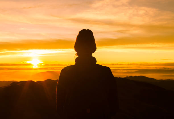 istock Female hiker watching beautiful sunrise 969253364