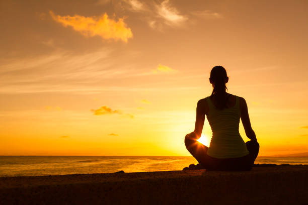 istock Woman relaxing by the sea 969253470