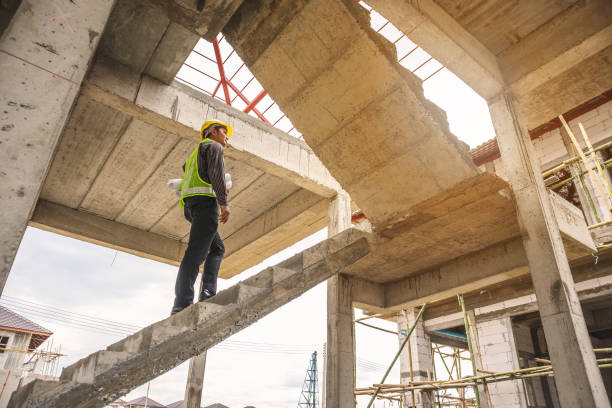 istock professional engineer worker at the house building construction site 969258952
