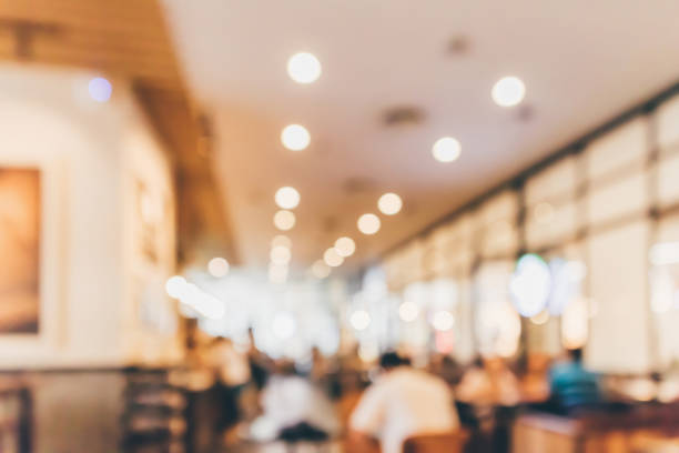 istock Restaurant cafe or coffee shop interior with people abstract defocused blur background 969259076