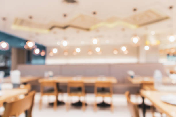 istock cafe restaurant interior with bokeh light abstract defocused blur background for create montage product display template 969259082