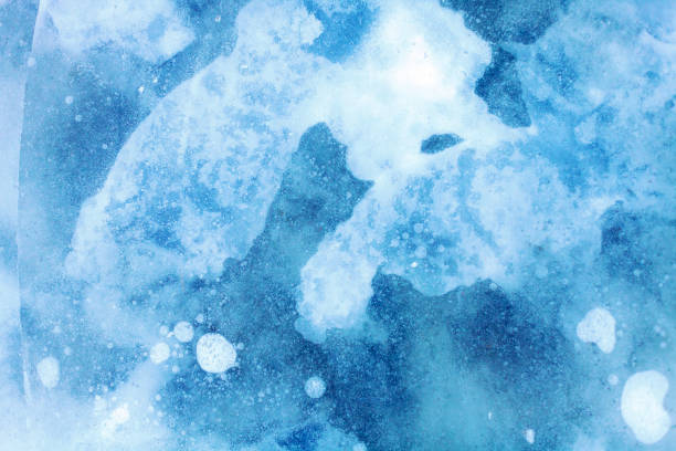 istock texture of a beautiful blue ice with cracks 969259278
