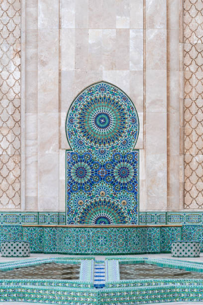 Cleansing fountain, Mosque Hassan II, Casablanca, Morocco Brightly tiled cleasnsing fountain on the exterior wall of Mosque Hassan II on the North Atlantic coast of Casablanca in Morocco casablanca morocco stock pictures, royalty-free photos & images