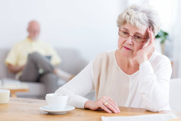 istock Sad elderly woman thinking about divorce with husband 969259790
