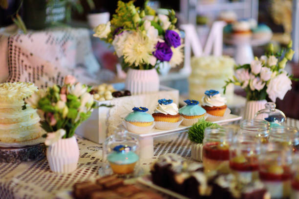 istock Decorated colorful cupcakes on a dessert table 969265450