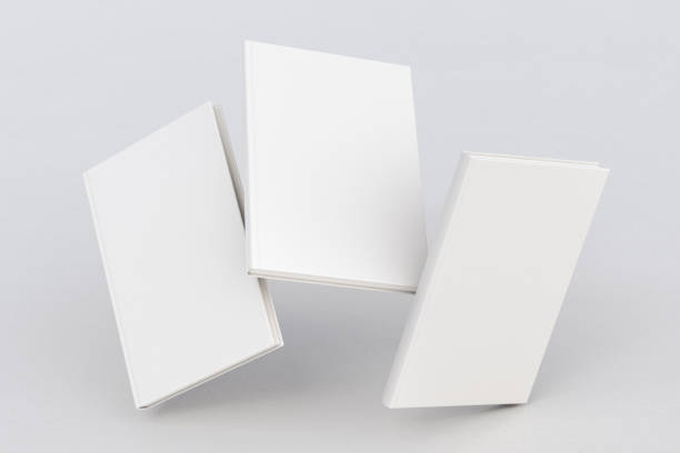 blank book cover flying White vertical three blank book cover flying over white background with clipping path around each book cover. 3d illustration paperback photos stock pictures, royalty-free photos & images