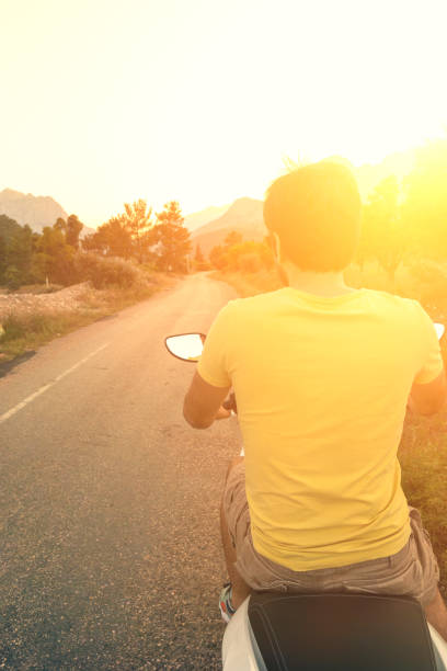 istock man posing on a scooter in a vacation context 969271356