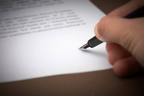 istock signing with fountain pen 96927277