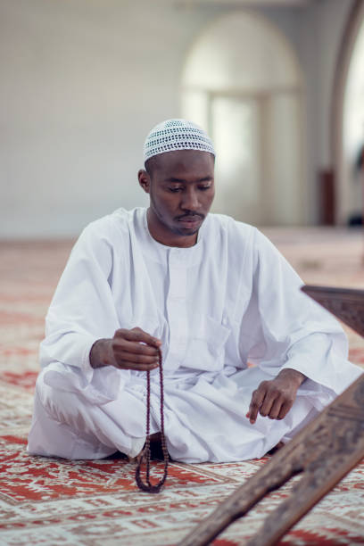 istock African Muslim Man Making Traditional Prayer To God While Wearing Dishdasha 969287538