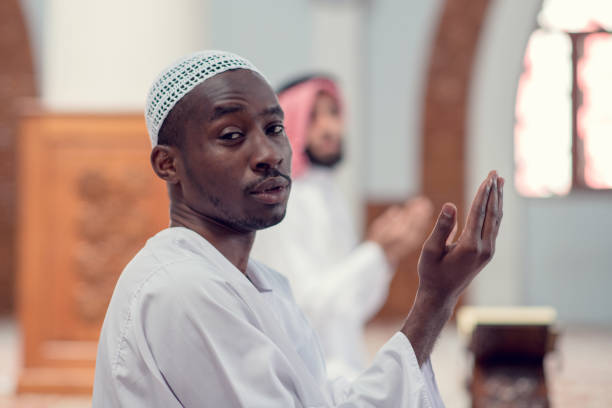 istock Two religious muslim man praying together inside the mosque 969290694