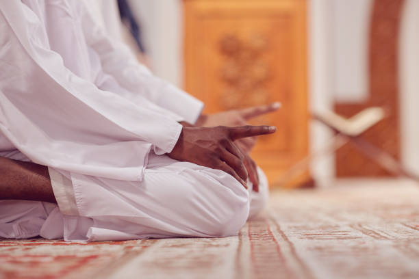 istock Two religious muslim man praying together inside the mosque 969291342