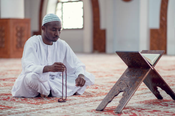 istock African Muslim Man Making Traditional Prayer To God While Wearing Dishdasha 969293700